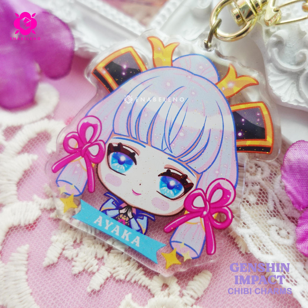 Cute keychains inspired by Inazuma Genshin Impact characters in chibi style drawing. Best glitter keychains gift for Travelers and Hoyoverse fans.
