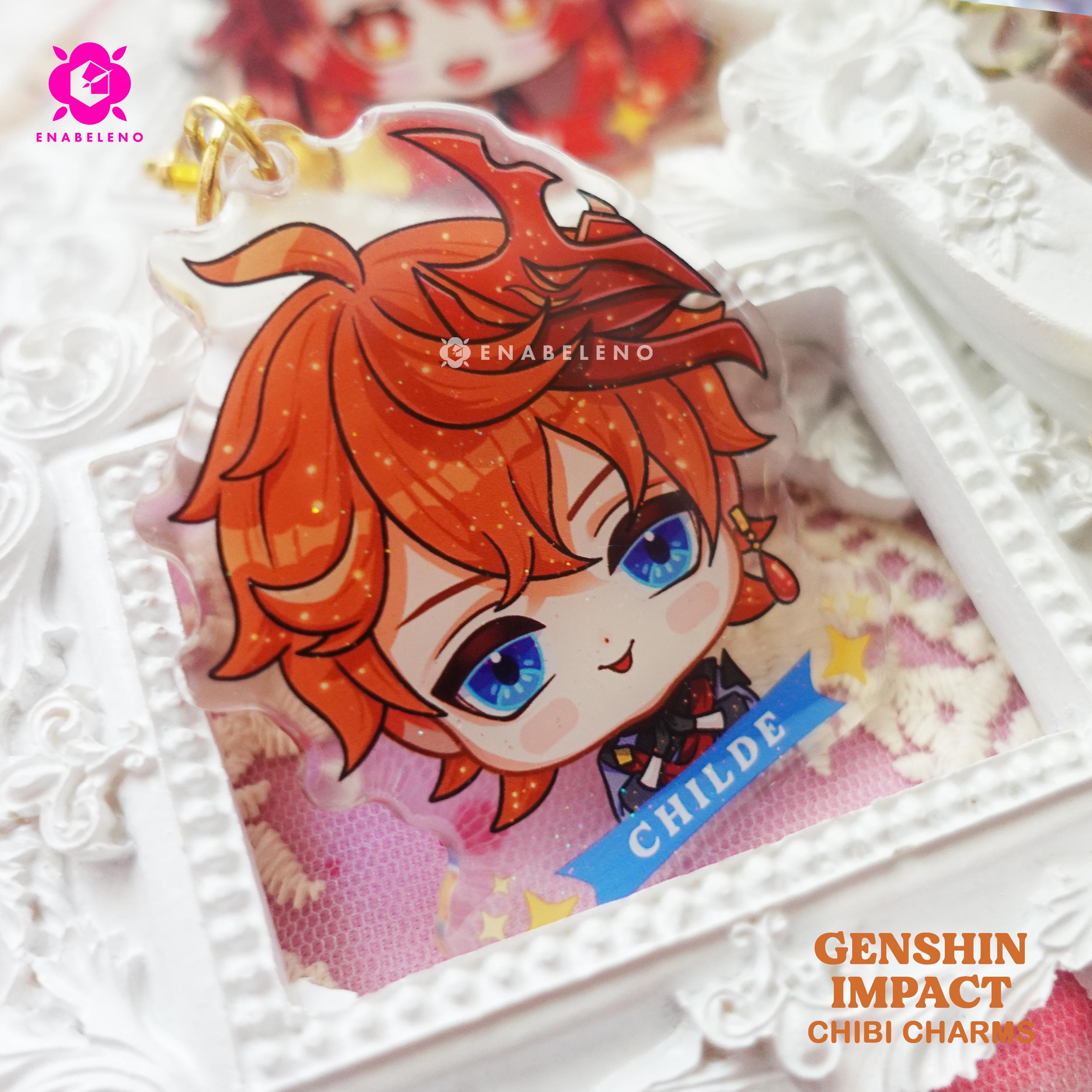 Cute Childe keychains inspired by the game Genshin Impact Liyue characters in chibi style drawing. Best glitter keychain gift for Travelers and Hoyoverse fans.