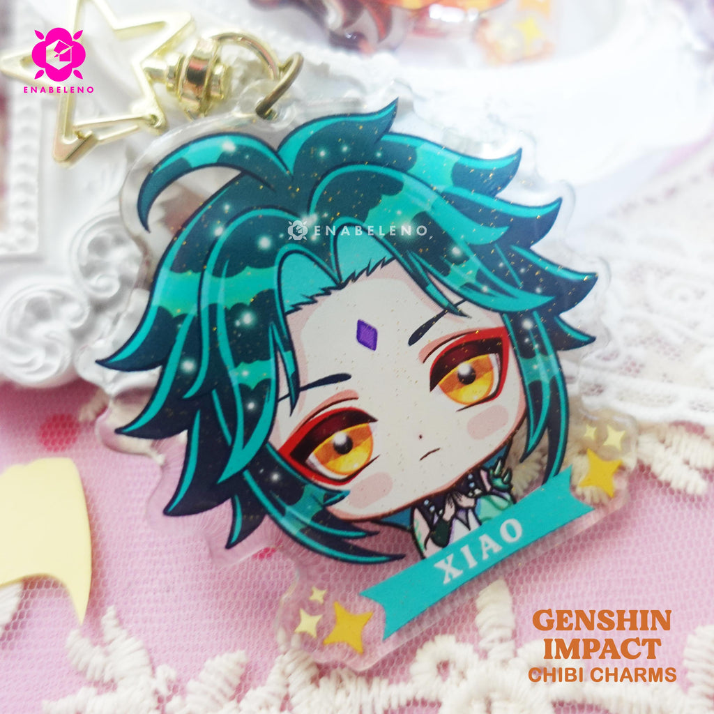 Cute Xiao keychains inspired by the game Genshin Impact Liyue characters in chibi style drawing. Best glitter keychain gift for Travelers and Hoyoverse fans.