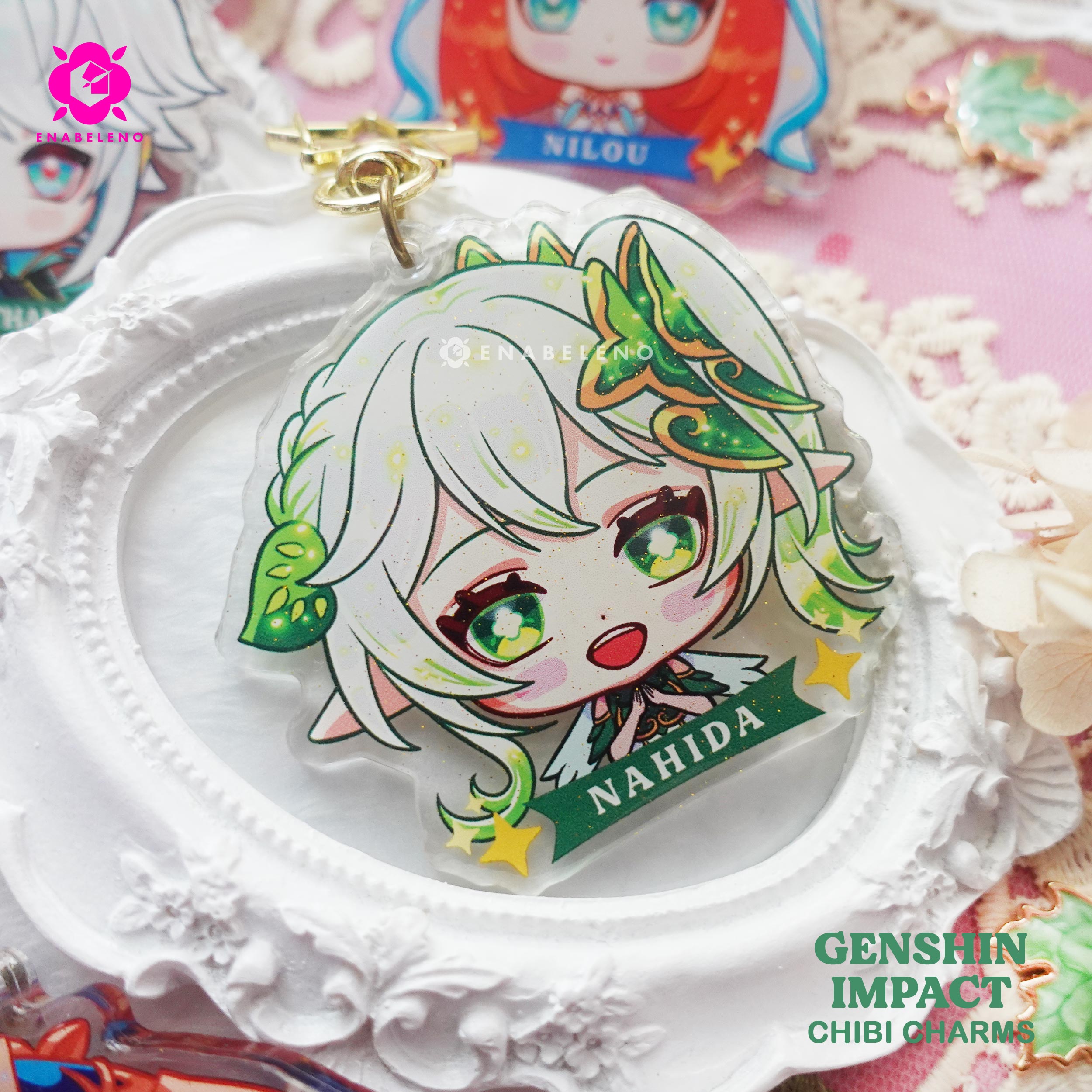 Cute keychains inspired by the game Genshin Impact Sumeru characters in chibi style drawing. Best glitter keychain gift for Travelers and Hoyoverse fans.