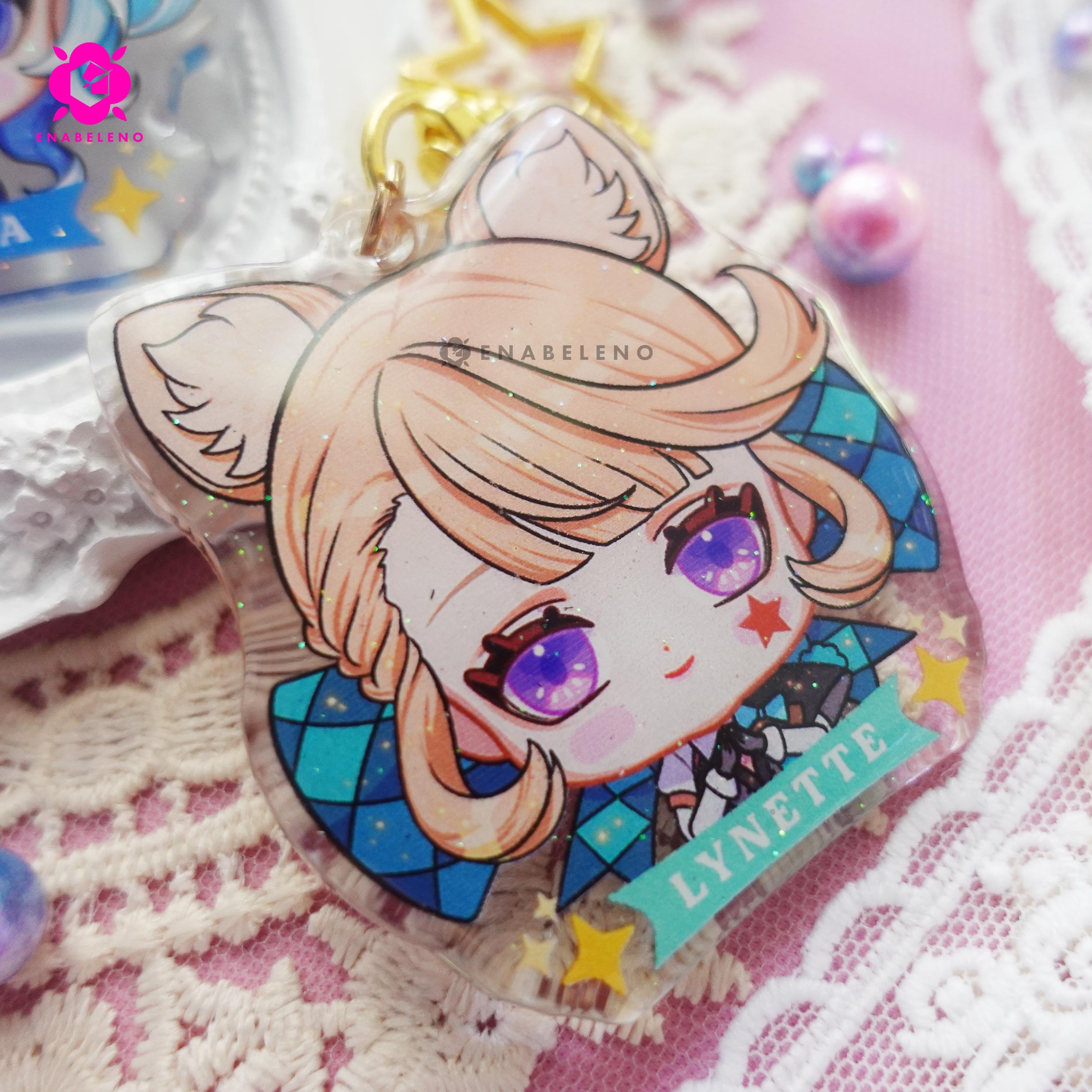 Cute keychains inspired by the game Genshin Impact Fontaine characters in chibi style drawing. Best glitter keychain gift for Travelers and Hoyoverse fans.